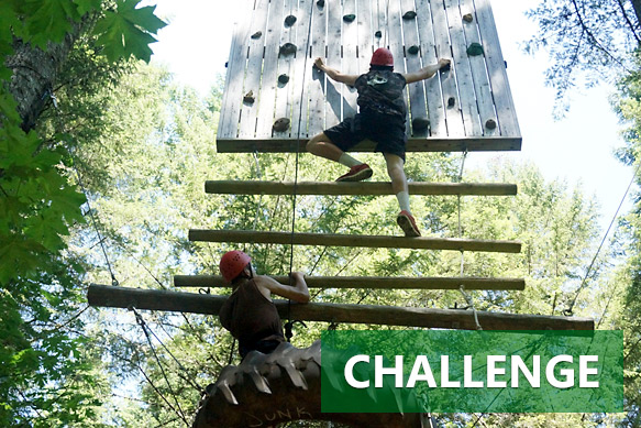 Climbing the junk yard high ropes element at Camp Yamhill's Challenge Course